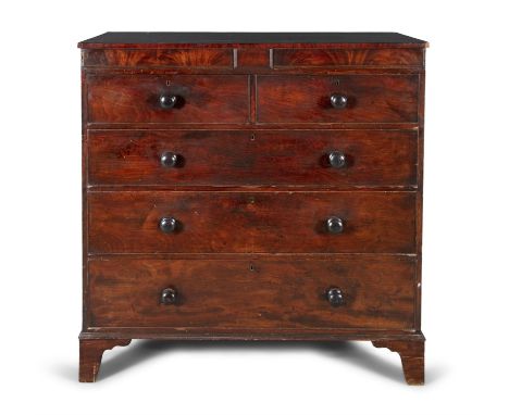 AN EARLY VICTORIAN MAHOGANY CHEST, of two short and three long drawers each fitted with turned button handles, on bracket fee