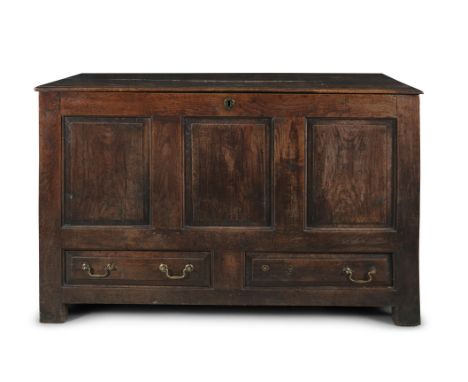AN EARLY GEORGIAN OAK AND ELMWOOD COFFER, of rectangular shape, with hinged two-plank top, above three fielded panels and two
