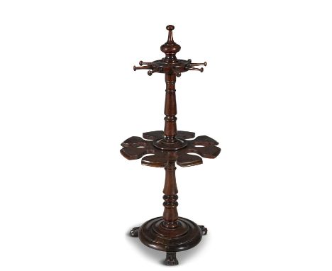 AN EARLY VICTORIAN MAHOGANY SNOOKER CUE STAND, of circular form with turned finial above eight extended pegs and circular und