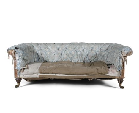 A VICTORIAN BUTTON BACK UPHOLSTERED CHESTERFIELD SETTEE, covered in sky blue fabric (distressed), raised on turned mahogany l