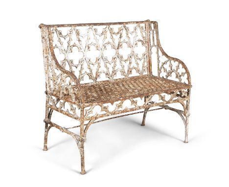 A GEORGE IV CAST IRON WHITE PAINTED GOTHIC GARDEN SEAT, PROBABLY TO COALBROOKDALE, the rectangular back pierced with lozenges