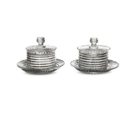 A FINE PAIR OF IRISH REGENCY CUTGLASS BUTTER POTS AND COVERS, with stands c.1800, each of cylindrical form, the flat covers w