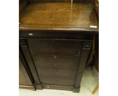 A Victorian oak wellington chest, the plain top above four full front cupboard doors raised on a plinth base CONDITION REPORT