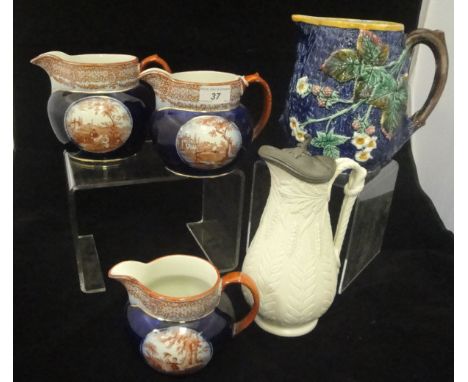 A collection of decorative china wares to include a 19th Century Wedgwood majolica jug relief decorated with flowering and fr