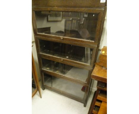 An early 20th Century oak Globe Wernicke style four section bookcase