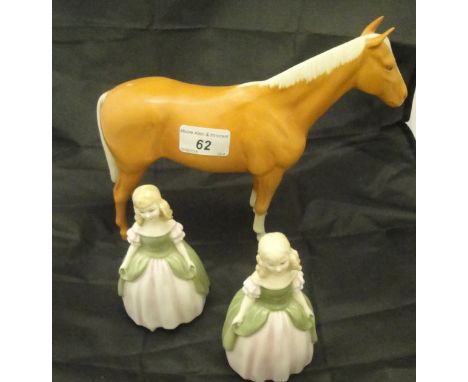 A Beswick Palomino horse figure and two Royal Doulton figurines "Penny" HN2338 (3)