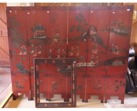 A six panel Chinese screen, the red ground decorated with various figures in traditional dress in a garden setting, together 