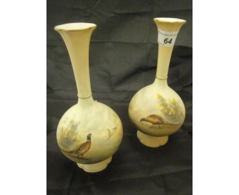 A pair of Royal China Works Worcester blushware stem vases of baluster form, each painted with pheasant in a landscape and be