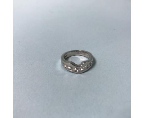 A platinum ring, mounted with seven diamonds, size J, 7g