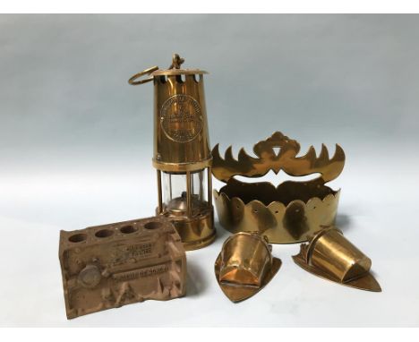 A miners lamp and a quantity of brassware