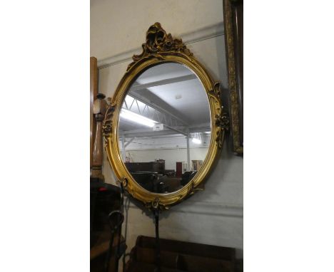 An Oval Gilt Framed Wall Mirror, 67cm High 