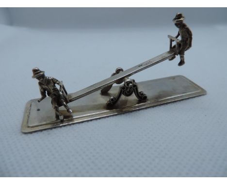A Dutch Miniature Silver Seesaw, with Two Children Playing, One Sitting Side-Saddle and the Seesaw Moves on its Pivot - Hallm