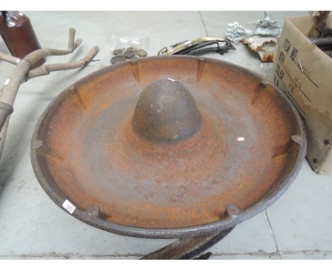 A vintage cast iron pig trough