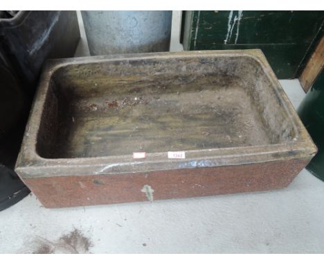 A vintage salt glazed trough or sink