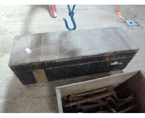 A wooden tool box and files