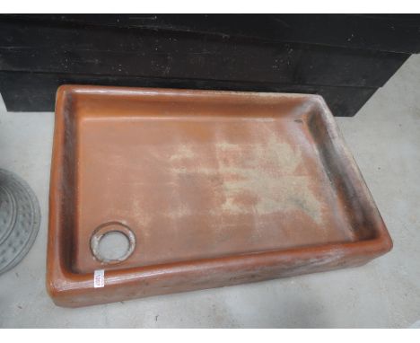 A shallow salt glazes trough