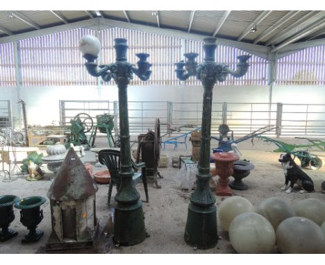 Two ornamental four stem lamp posts 