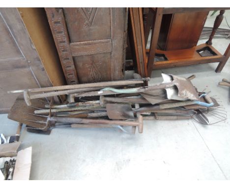 A selection of vintage garden and hand tools