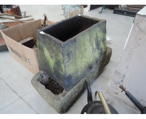 A vintage stone trough and similar ceramic