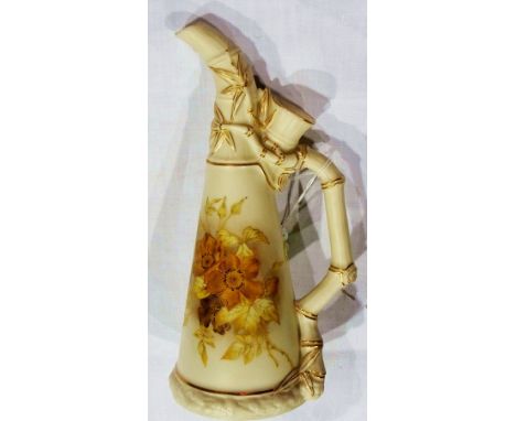 Late Victorian Royal Worcester ewer with bamboo-shaped spout and handle, the ivory ground decorated with autumnal floral spra