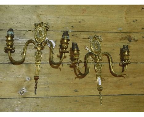 A metal table lamp, lamp shade and a pair brass two-light wall brackets