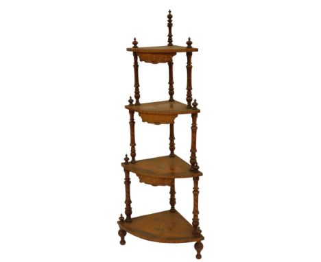 A Victorian walnut and inlaid corner whatnot, each shelf with urn and scroll decoration, united by turned carved supports, on
