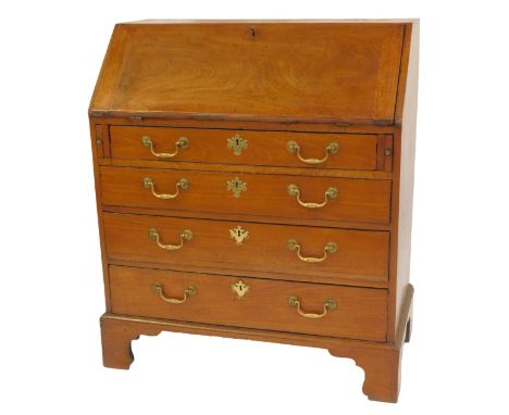 A George III mahogany bureau, the fall enclosing an arrangement of drawers, recesses, cabinet, etc., the base with four drawe