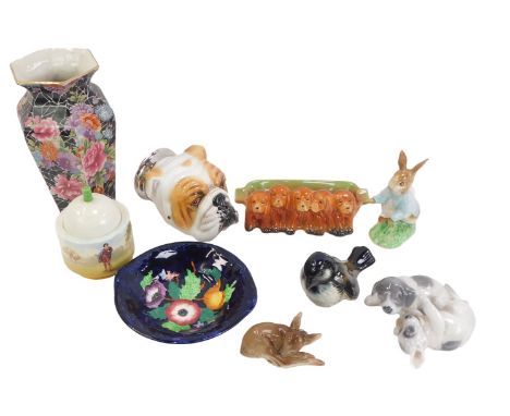 A group of 20thC ceramics, comprising a Goebel bird, a Royal Copenhagen puppy figure group, a Royale Stratford stirrup cup fo