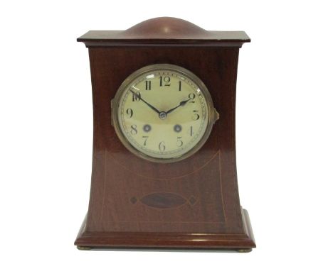 A mid 20thC mahogany cased Art Nouveau style mantel clock, the shaped and domed top with boxwood inlay, with a white enamel n
