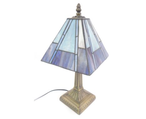 A Tiffany style table lamp, with dark and light blue shade, on an out swept stem, 40cm high. 