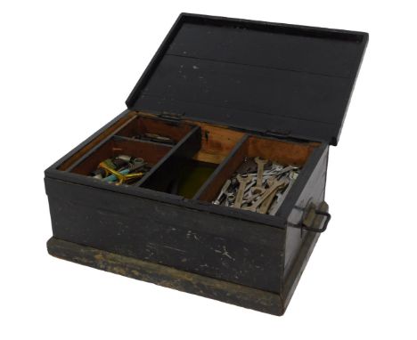 An ebonised tool chest, containing tools including hammers, ring spanners, gauges, Allen keys, tap and die set, a pipe wrench
