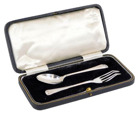 A George V presentation silver serving set, comprising fork and teaspoon, each with leaf moulded terminal, Birmingham 1935, 1