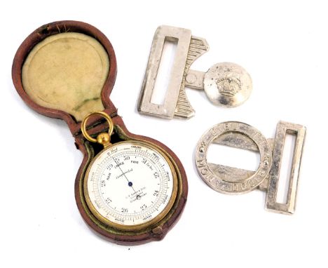 A brass cased pocket barometer, in leather case, and a military steel belt.