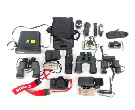 Various camera and optics equipment, comprising a Nikon Krunia S, a Canon EOS 650, an Olympus M2, various camera cases, a set