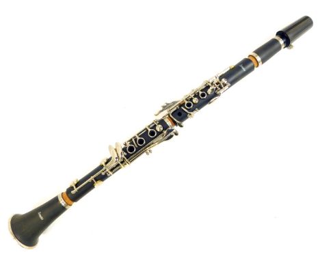 A Sonata clarinet, in soft shell backpack carry case. 