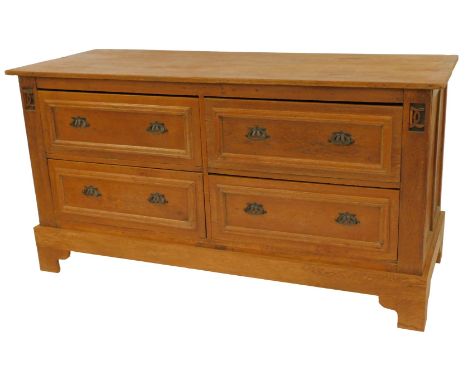 A 20thC Continental oak chest, of four deep drawers with moulding, carved motifs to each side, on bracket feet, 95.5cm high, 