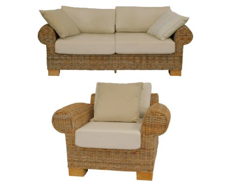 A wicker conservatory suite, comprising two seater sofa and armchair, with loose seats and back cushions. 