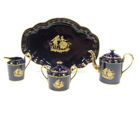A Limoges Castel pattern part coffee set, comprising a serving tray, a coffee pot, a milk jug and a sucrier, with 22ct gold h