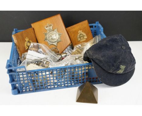 A box of mixed collectables to include military button, badges and patches, police helmet badge....etc.. 