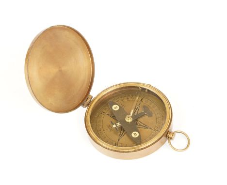Brass cased 'Spitfire Compass', the compass hand / indicator in the form of a Spitfire, with locking mechanism. Measures appr