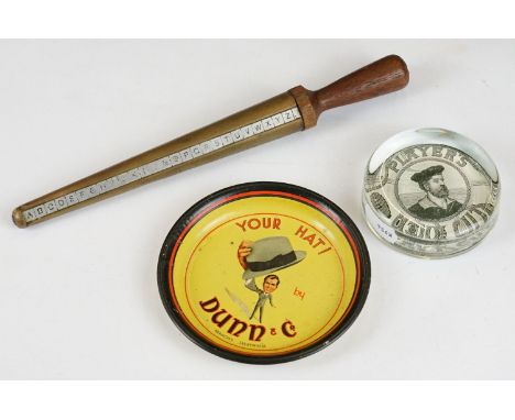 A players Navy cut glass paperweight together with a Dunn &amp; Co advertising ashtray and a ring sizer. 