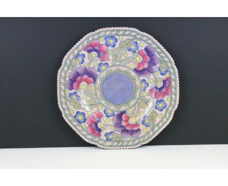 Charlotte Rhead for Crown Ducal shaped circular plate, tube lined with stylised flowerheads, blue dash border, on a mottled o