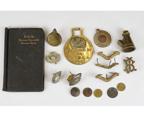 A small group of mixed collectables to include a 1923 B.S.A, motorcycle pocket book together with brass ware, buttons, coin..