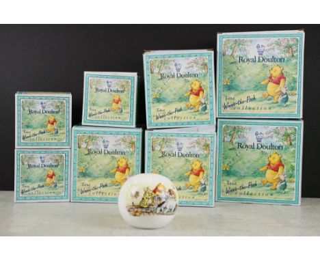 Eight boxed Royal Doulton 'Winnie The Pooh Collection' ceramics / figures to include a Christopher Robin figure and teacups &