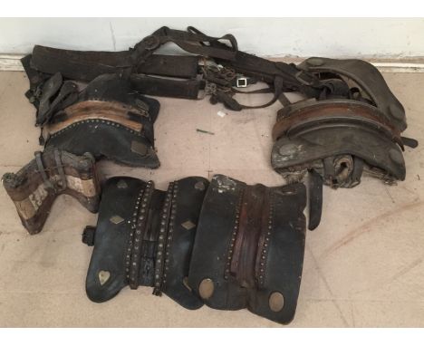 WORKHORSE SADDLES AND HARNESSES - Lot to include seven pieces of leather saddles, harnesses and chains which would have been 