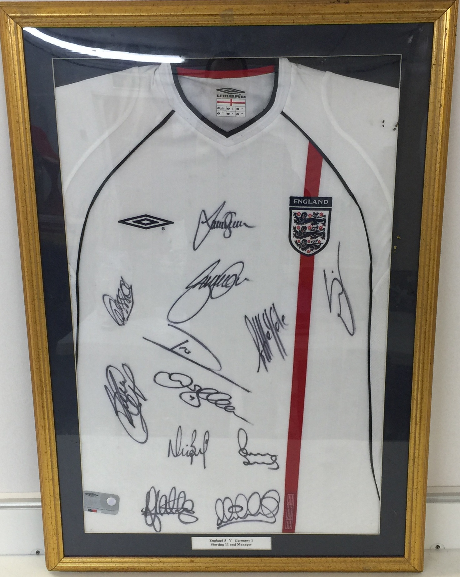 ENGLAND SIGNED SHIRT 51 GERMANY A mounted and framed England shirt