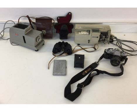 CAMERAS AND BINOCULARS - To include a Minolta X-300 with lens and case, a pair of Carl Zeiss Jenoptem binoculars with case. A