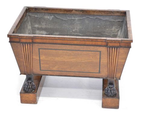Regency mahogany plant trough of sarcophagus shape, black beading and stringing, reeded decoration, meeting ebonised animal p