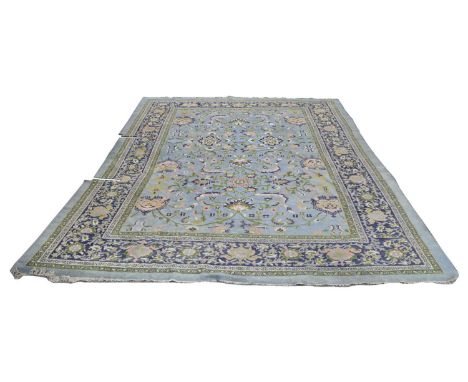 Large late 19th-century carpet square, light blue field with green terracotta and blue tendril decoration, multi-banded borde
