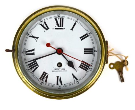 Early 20th-century ships bulkhead clock, 8-day movement, minute sweep hand, Roman numerals, white enamel dial signed Smith's,